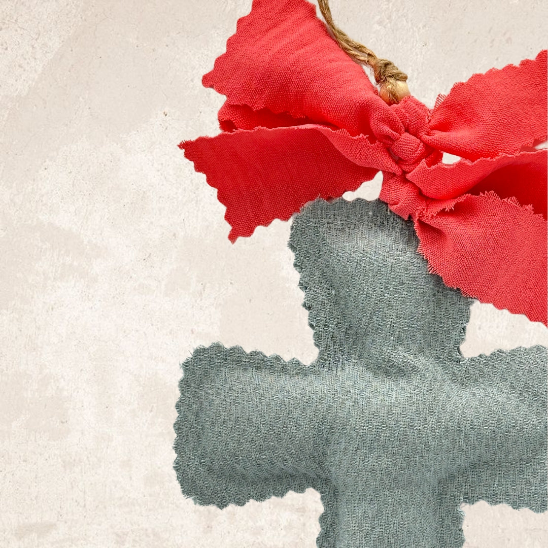 Aqua green cross + coral bow