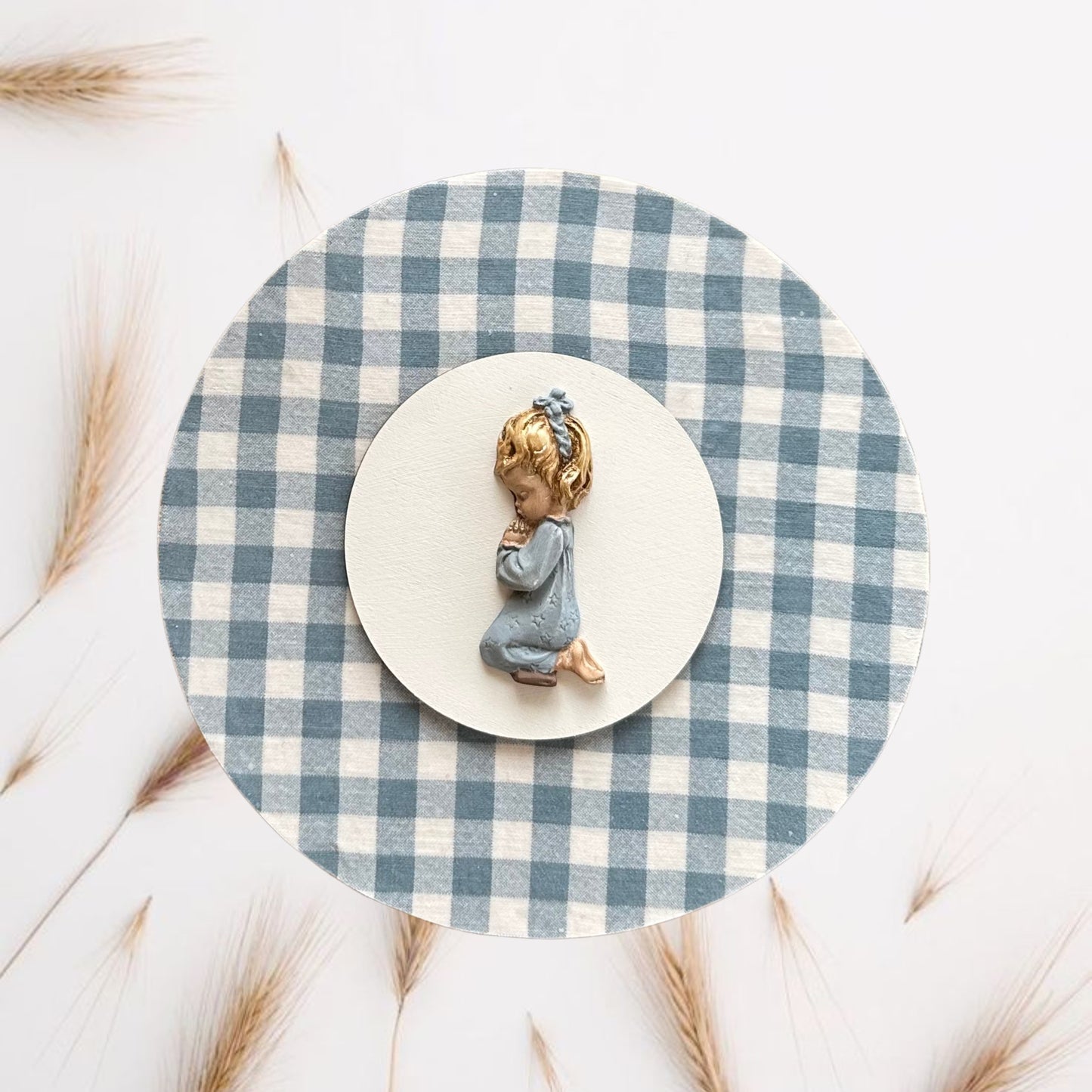 Girl praying in blue gingham painting