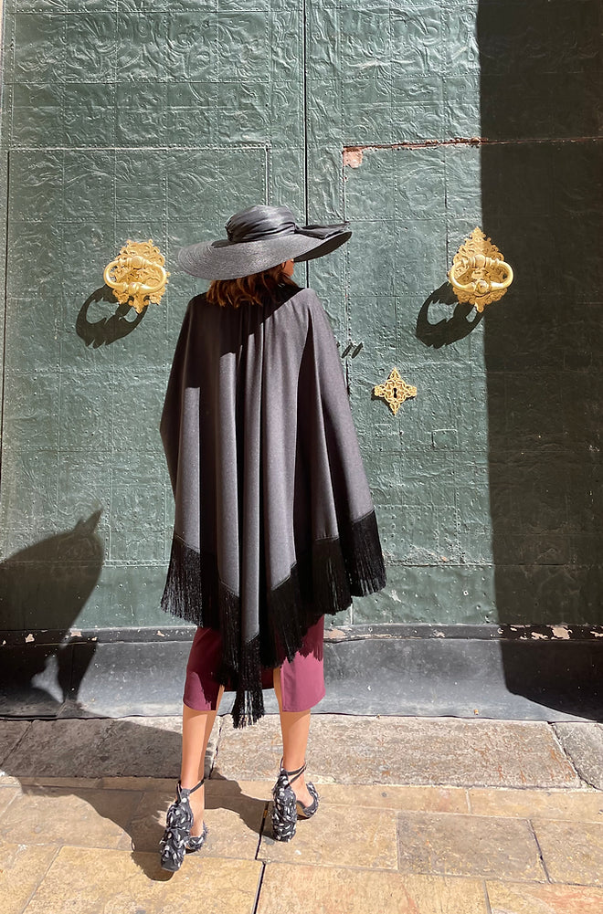 Luci cape with fringes